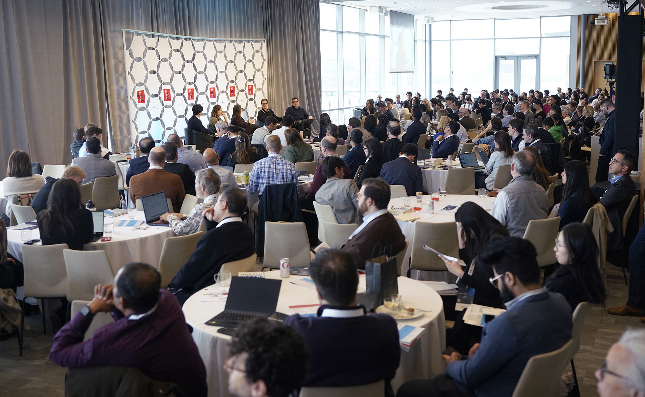 BIGAI at MIT 2026 crowd in Samberg Conference Center watching the event panel