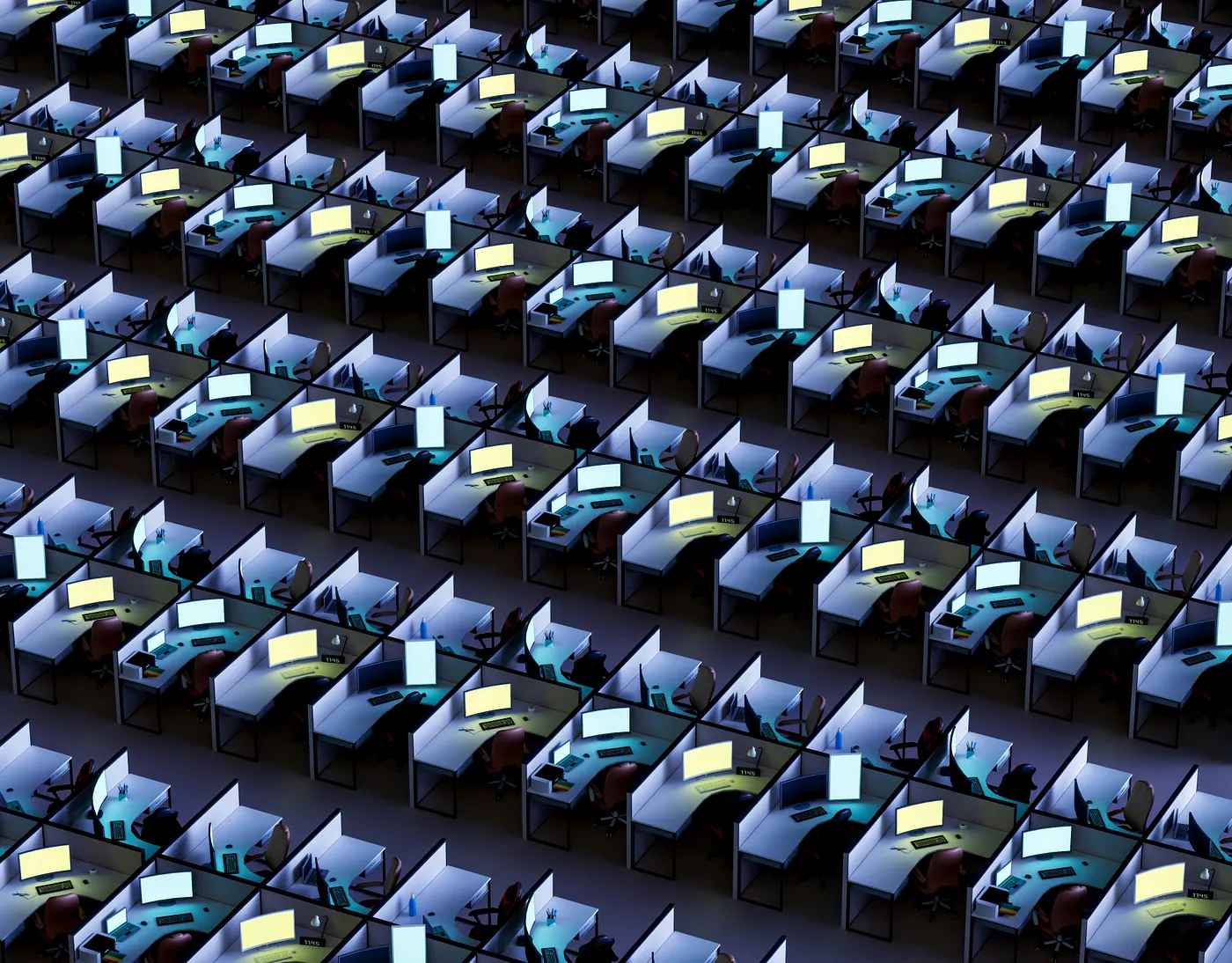 Countless rows of desks with computers on top