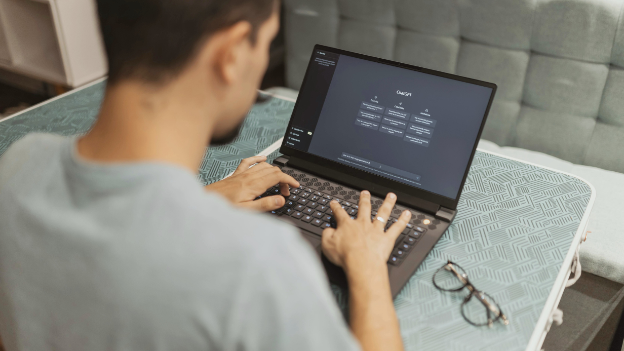 man at a computer using chatgpt